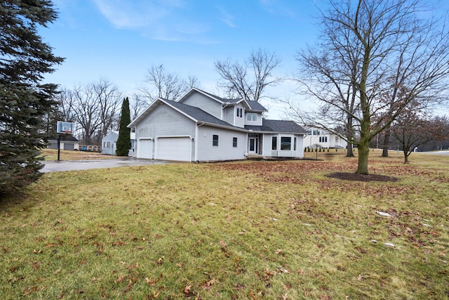 view of front of home with a garage and a front yard