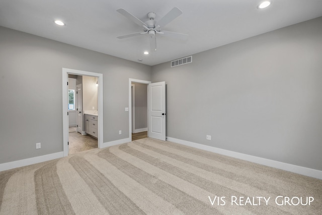 unfurnished bedroom with baseboards, recessed lighting, visible vents, and light colored carpet