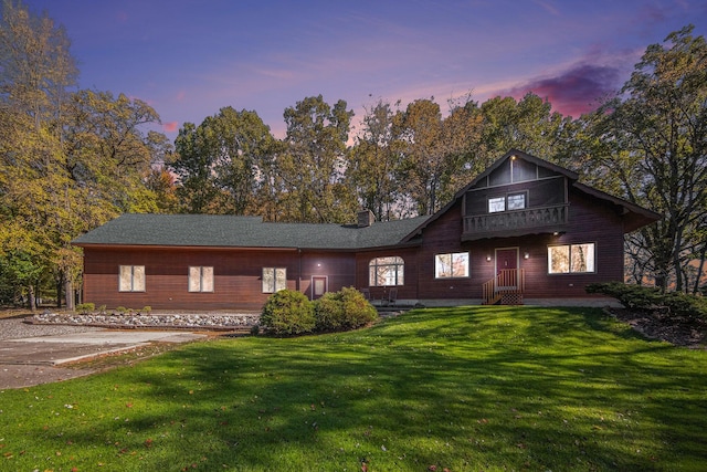 view of front of home with a yard