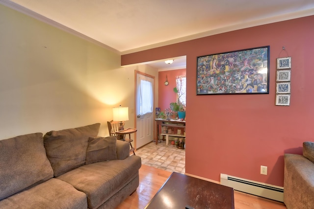 living room featuring crown molding, baseboard heating, and light hardwood / wood-style floors