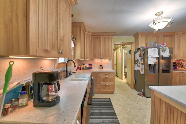 kitchen featuring sink, light brown cabinets, and stainless steel refrigerator with ice dispenser