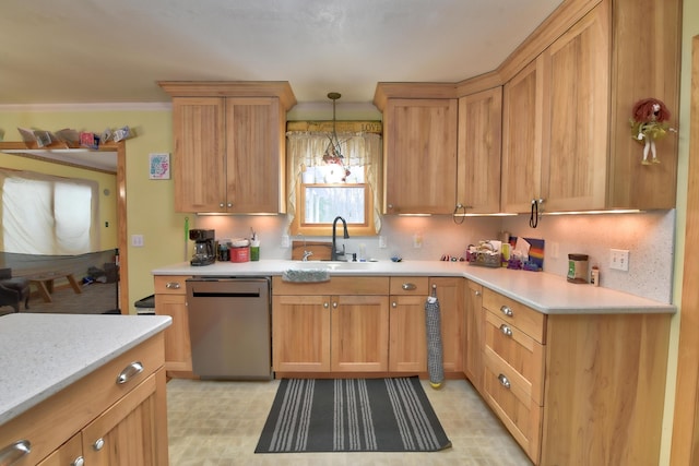 kitchen with pendant lighting, sink, backsplash, and dishwasher