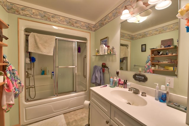 bathroom with vanity and shower / bath combination with glass door