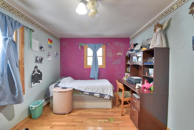 bedroom with wood-type flooring