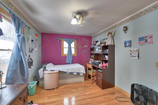 bedroom with light hardwood / wood-style flooring