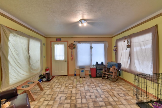 foyer entrance with a textured ceiling