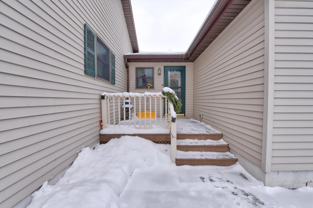 view of snow covered property entrance