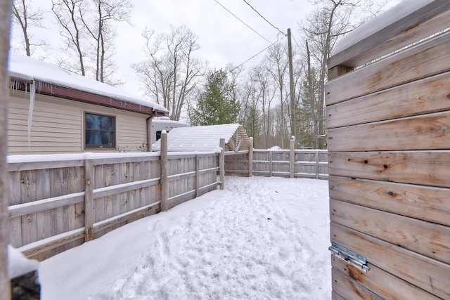 view of yard layered in snow