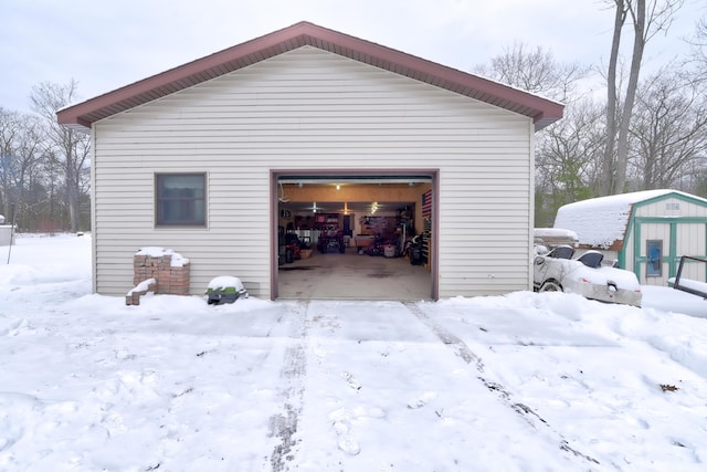 view of snow covered garage