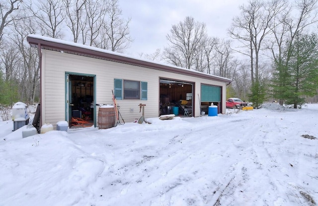 view of snow covered garage