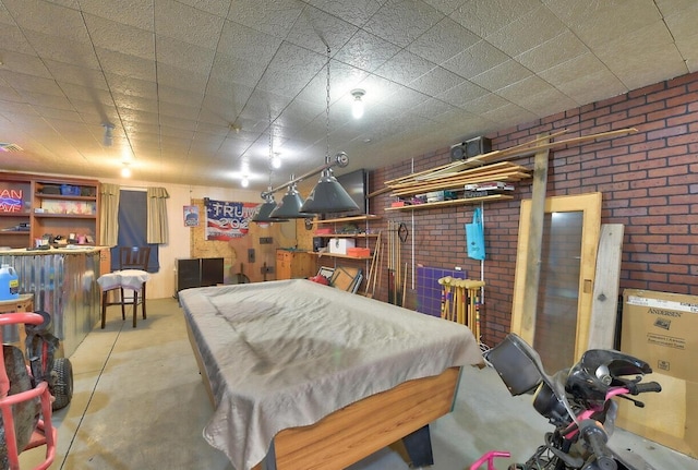 playroom featuring brick wall and billiards