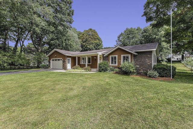 ranch-style house featuring a garage and a front lawn