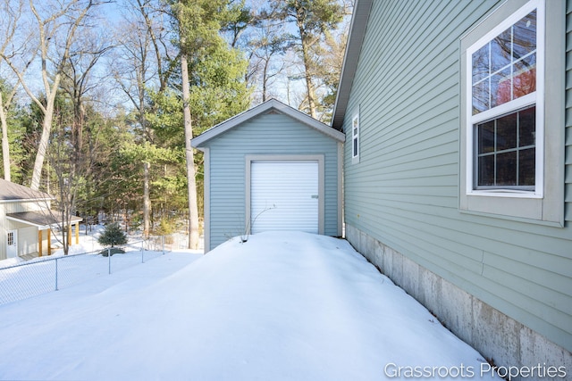 view of snow covered garage