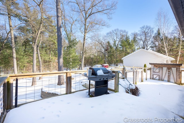 snow covered deck featuring grilling area