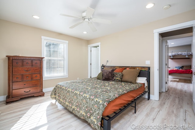 bedroom with ceiling fan and light wood-type flooring