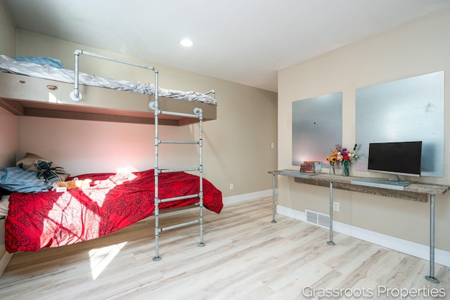 bedroom with light hardwood / wood-style flooring