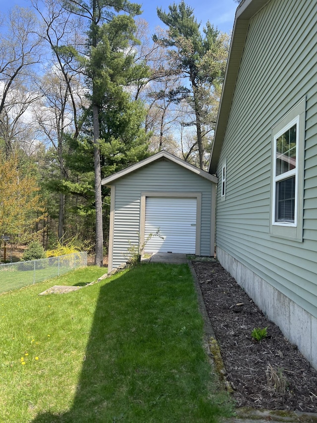 6474 Blackhawk Ln, Twin Lake, MI 49457 - view of yard featuring an outbuilding and a garage