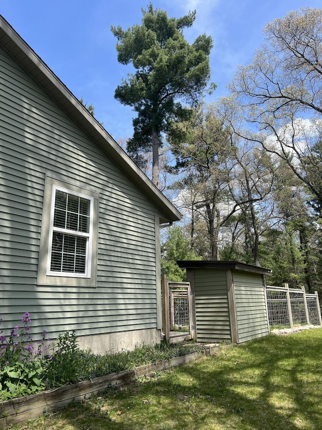 6474 Blackhawk Ln, Twin Lake, MI 49457 - view of home's exterior featuring a shed and an outbuilding