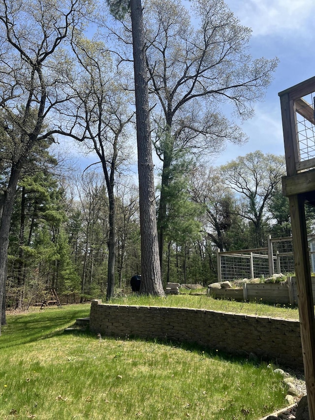6474 Blackhawk Ln, Twin Lake, MI 49457 - view of green lawn featuring a vegetable garden