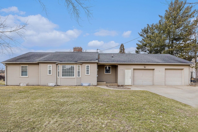 single story home featuring a garage and a front yard