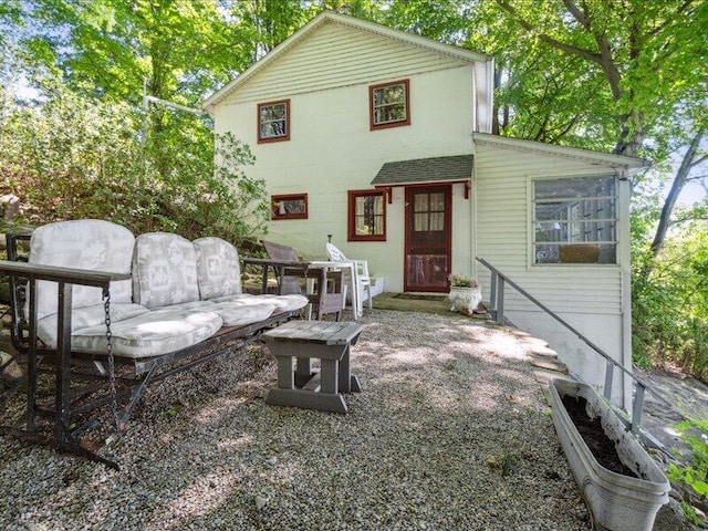 back of property with a patio