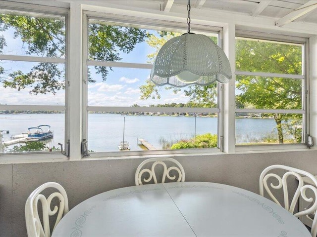 dining space with a water view