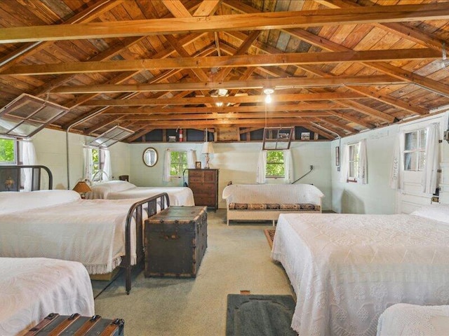 bedroom with vaulted ceiling and carpet