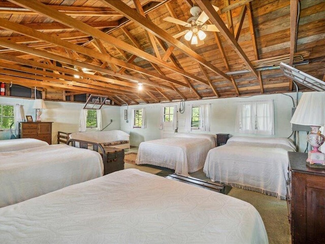 bedroom featuring multiple windows and vaulted ceiling