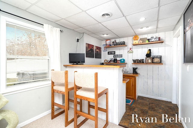 bar featuring a paneled ceiling