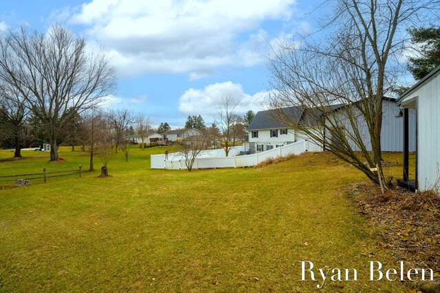 view of yard with a pool
