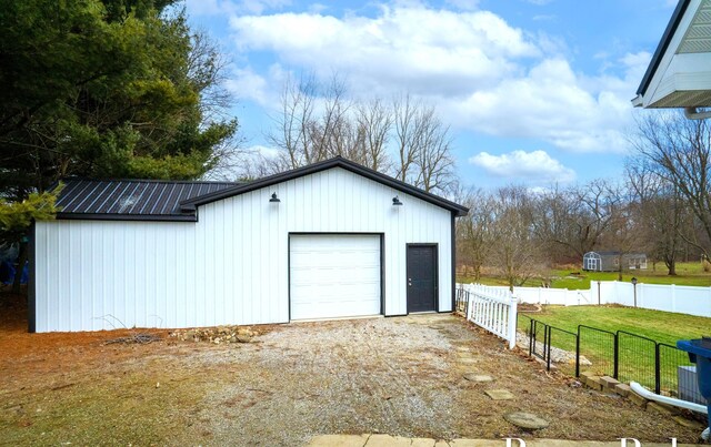 garage with a lawn