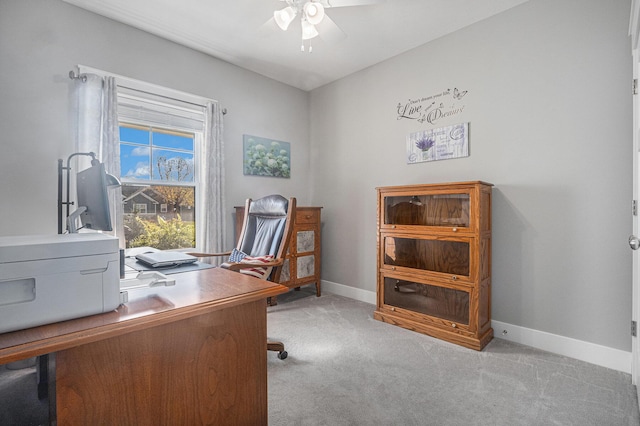 office space with light colored carpet and ceiling fan