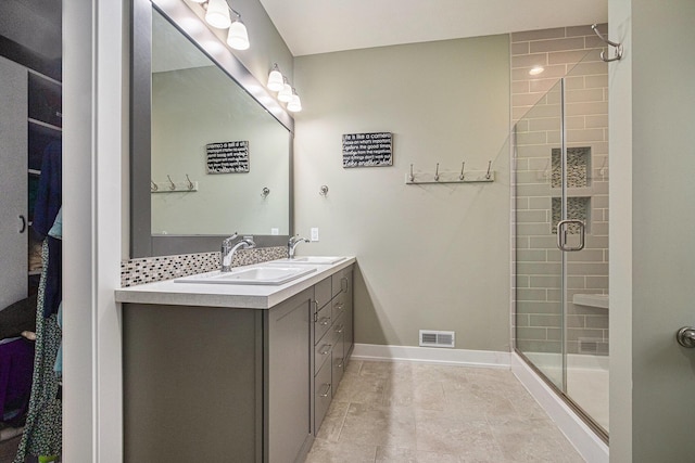 bathroom with vanity and an enclosed shower