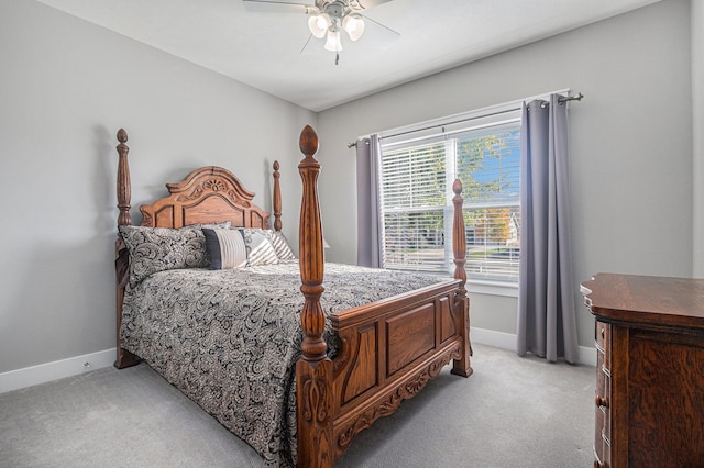 bedroom featuring light colored carpet and ceiling fan