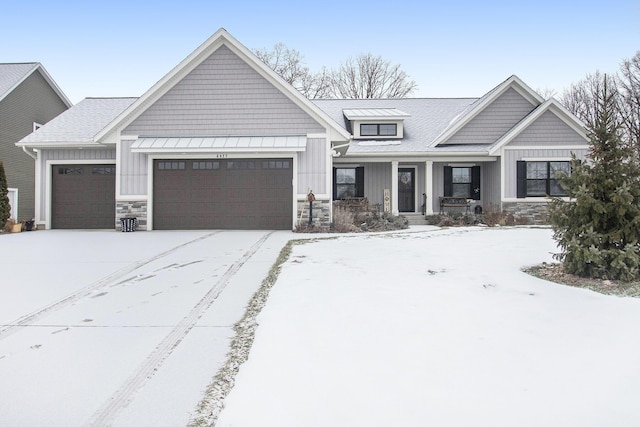 view of front of home featuring a garage and covered porch