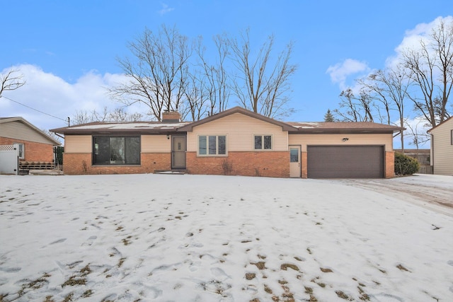 single story home featuring a garage