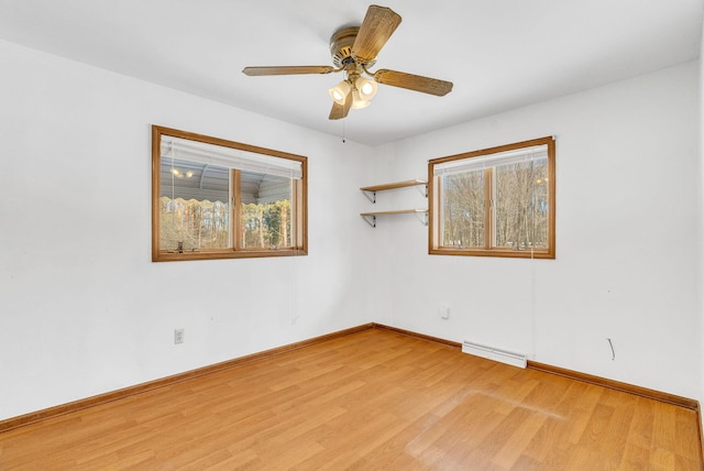 spare room featuring ceiling fan and light wood-type flooring