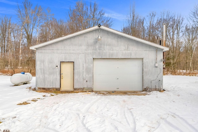 view of snow covered garage