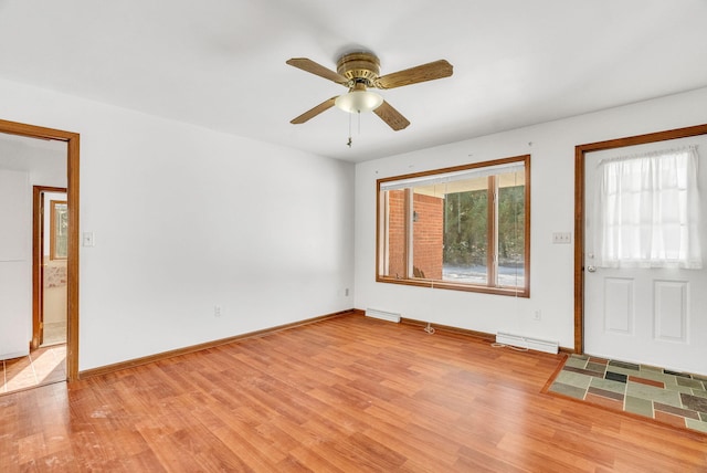 foyer entrance featuring ceiling fan and light wood-type flooring