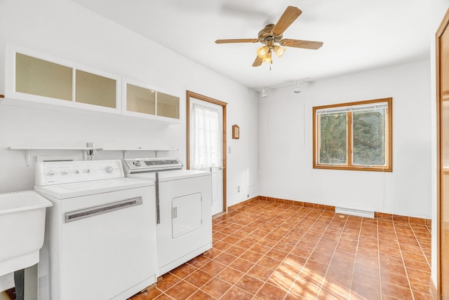 laundry room with separate washer and dryer, sink, light tile patterned floors, and ceiling fan