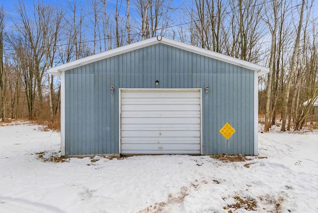 view of snow covered garage