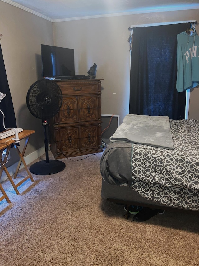 bedroom with carpet floors and ornamental molding