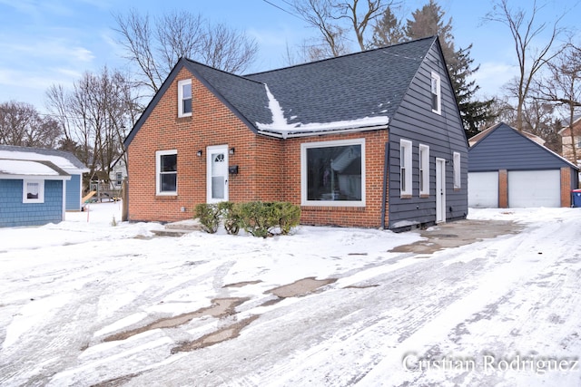 view of front of property with a garage and an outdoor structure