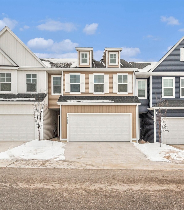 townhome / multi-family property featuring a garage