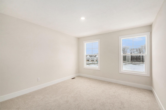 unfurnished room featuring carpet floors