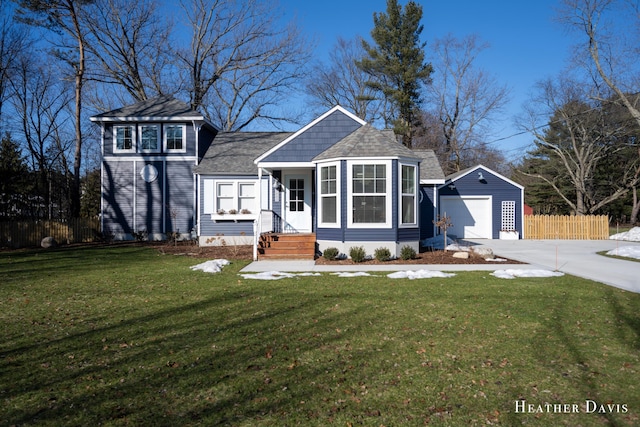 view of front facade with a garage, an outdoor structure, and a front yard