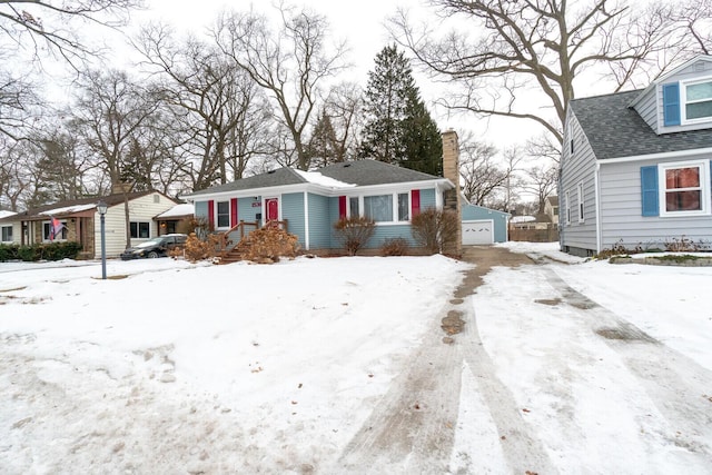 view of front of property with an outbuilding and a garage