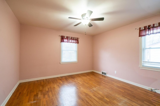 unfurnished room featuring ceiling fan and wood-type flooring