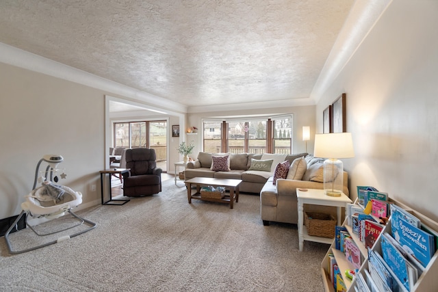 living room with a textured ceiling, carpet floors, and a healthy amount of sunlight