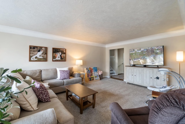 living room with carpet floors and a textured ceiling